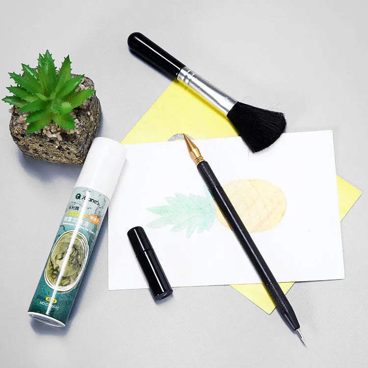 Scratch art painting kit with tools, healing pen, photo frames, and gift bag on a white card surface.