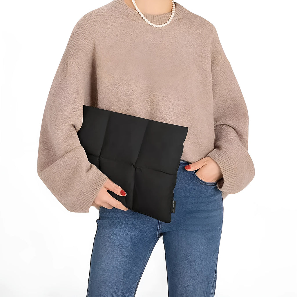 Soft fluffy black polyester laptop sleeve for 13 to 15.6 inch laptops with sewing thread details.