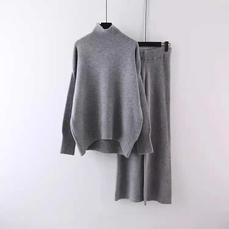 Women's casual two-piece set with an acrylic sweater and wide-leg trousers in a solid colour.