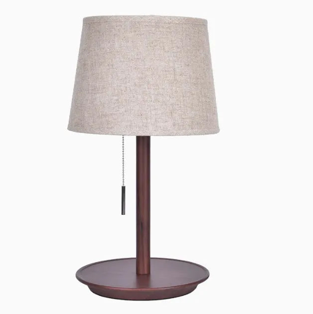 Walnut-colour solid wood bedside lamp with white cloth shade and cable switch