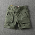Men's cotton cargo shorts in khaki colour with multiple pockets and a straight leg design.