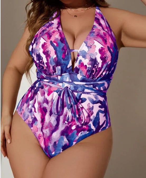 Blue women's halter neck one-piece swimsuit on a mannequin showing brief cut design