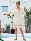 Women's apricot hand-crocheted beach dress with polyester lining shown on hanger