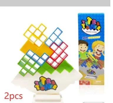 Plastic balance stacking game with coloured blocks on chassis for family play