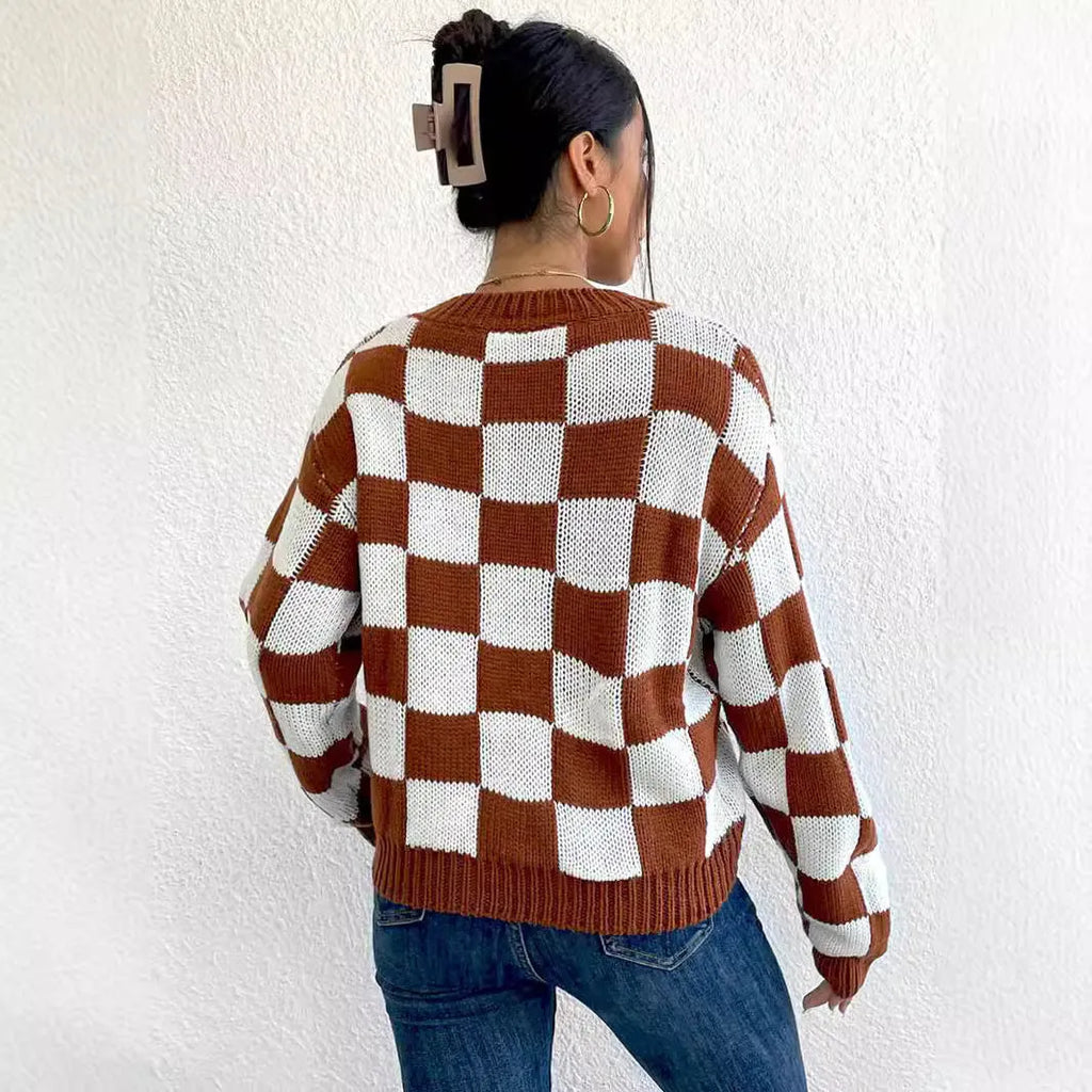 Dark brown plaid pattern acrylic pullover sweater with round neck and long sleeves on hanger