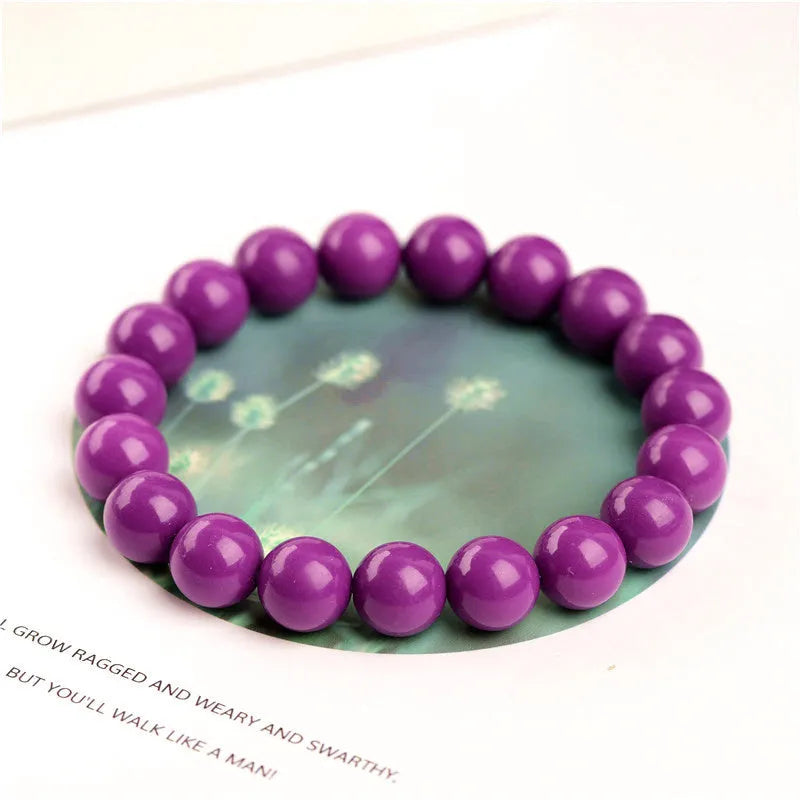 Jiuya polished crystal bracelet in purple mica colour, showing single strand of round beads.
