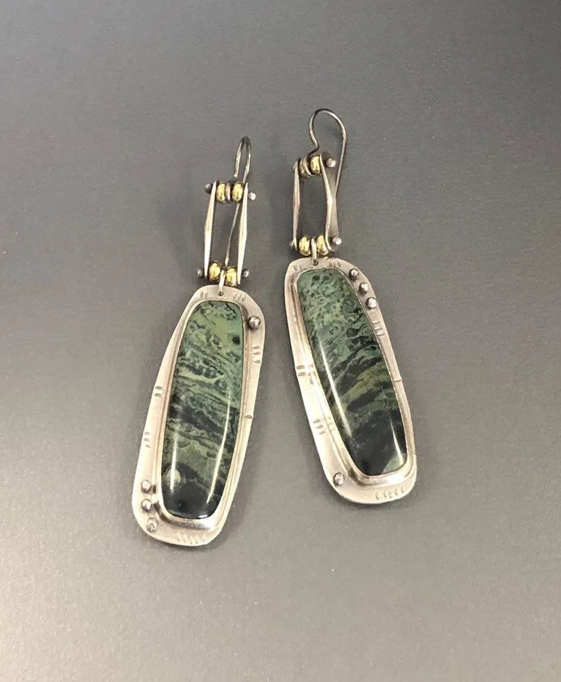 Women's geometric drop earrings with a two-colour marble pattern on alloy metal.