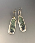 Women's geometric drop earrings with a two-colour marble pattern on alloy metal.