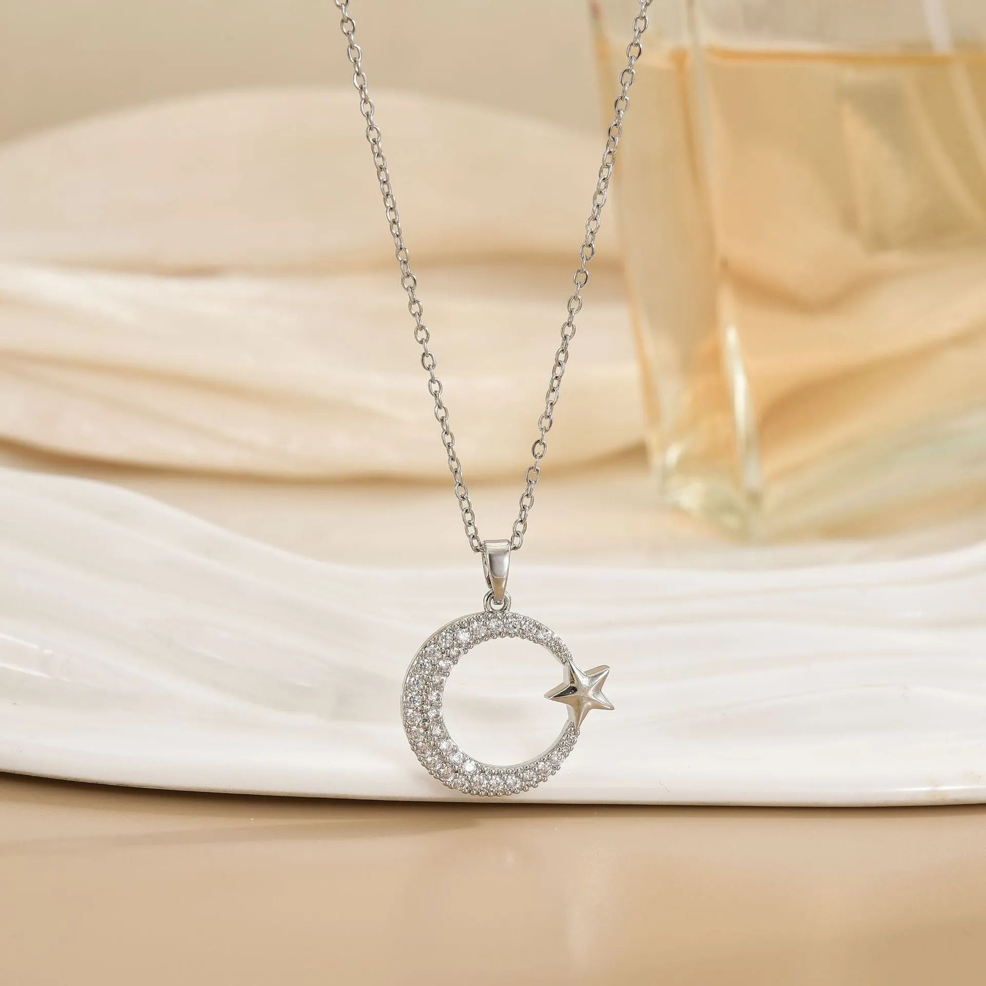 Gold electroplated geometric moon zircon pendant on titanium steel O-ring chain necklace