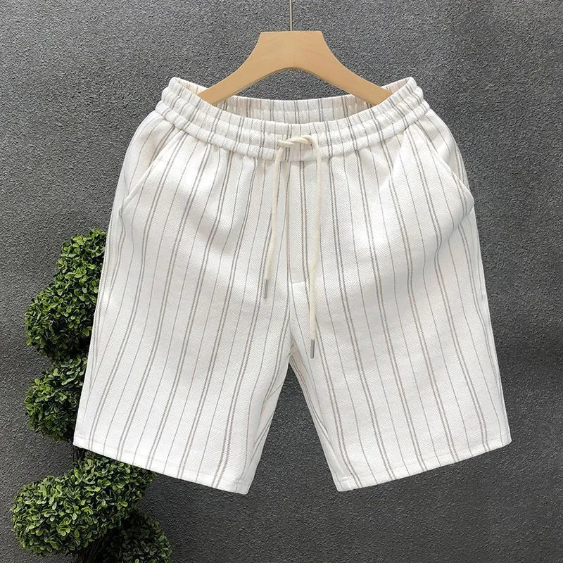 Men's black and white striped fleece-lined casual shorts with elastic waistband showing straight leg ankle banded design