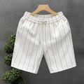 Men's black and white striped fleece-lined casual shorts with elastic waistband showing straight leg ankle banded design