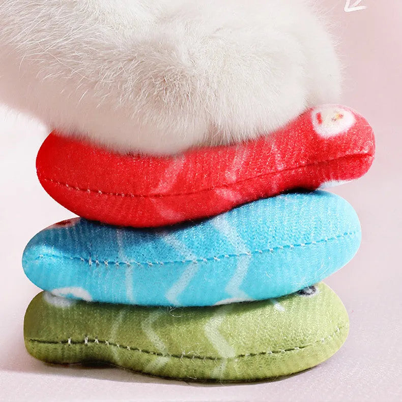 Sky blue plush simulated fish cat toy with realistic animal pattern on a neutral background.