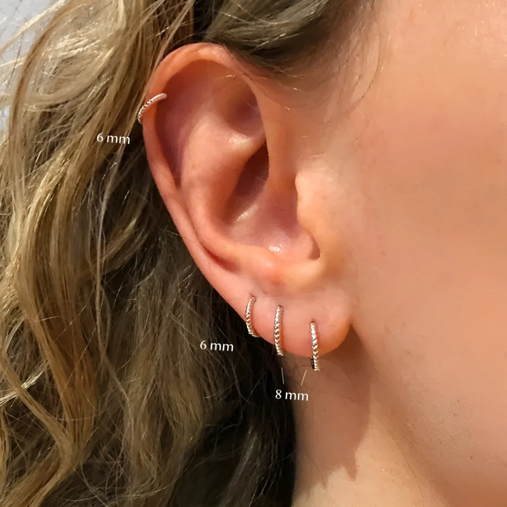 S925 sterling silver twisted string round ring stud earrings in gold and white gold finishes.