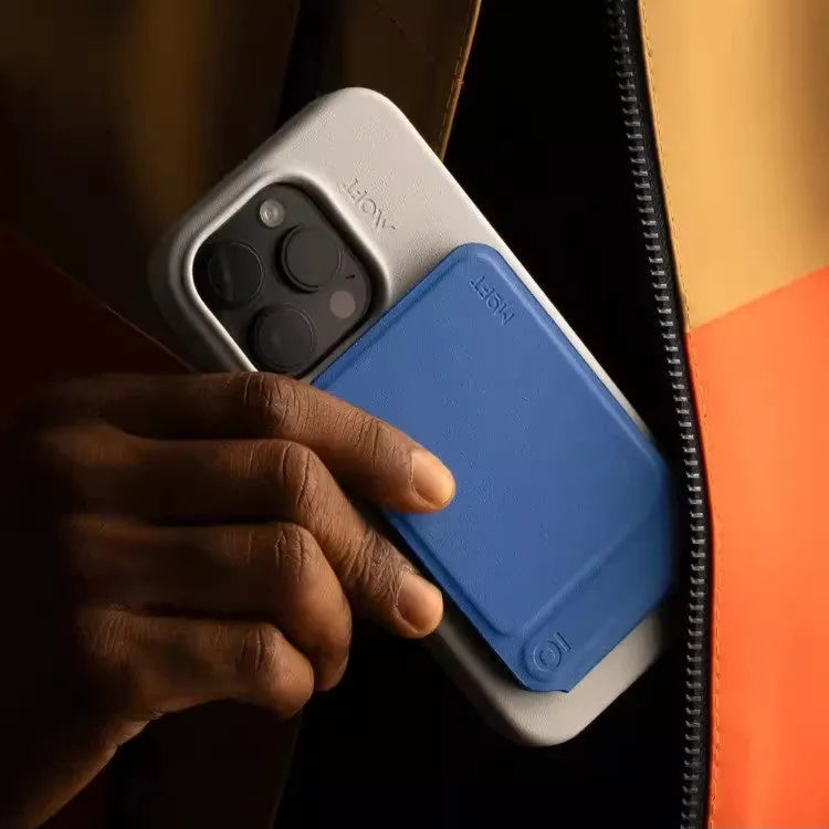 Black magnetic mobile phone holder case made from MOVAS leather and fibreboard, shown next to a phone.