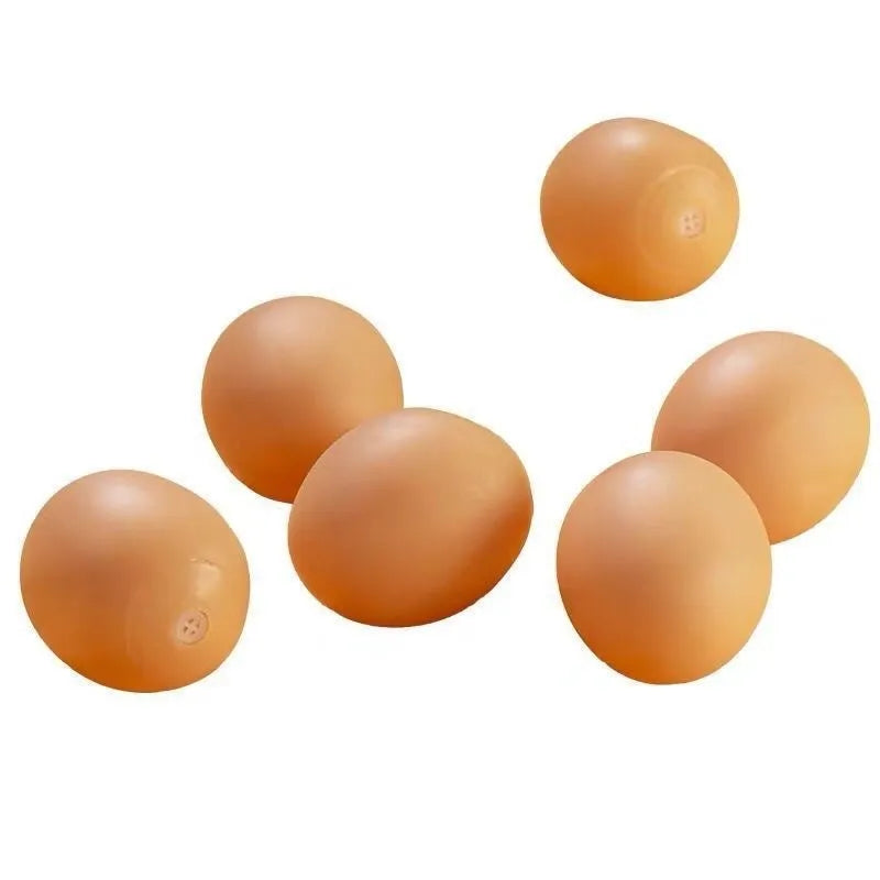 White plastic egg-shaped dog toy with textured surface for tooth cleaning and sound features