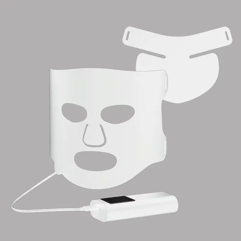 Black and white LED phototherapy face mask with controller for home skin light therapy treatment.