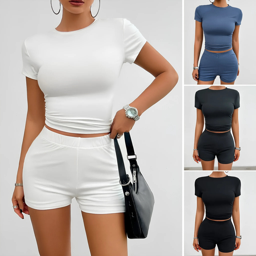 Women's solid colour slim-fit two-piece sports set with short-sleeved T-shirt and elastic waist shorts.