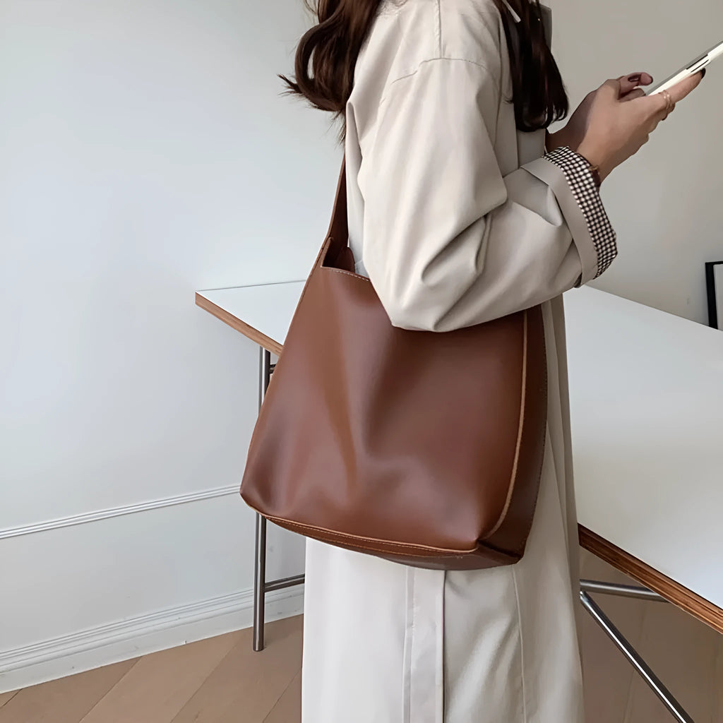 Women's soft PU leather shoulder bag with swing threads in black ribbon and brown with packet styles