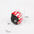 Small hard plastic helmet for a chicken or bird with elastic straps and a colourful design.