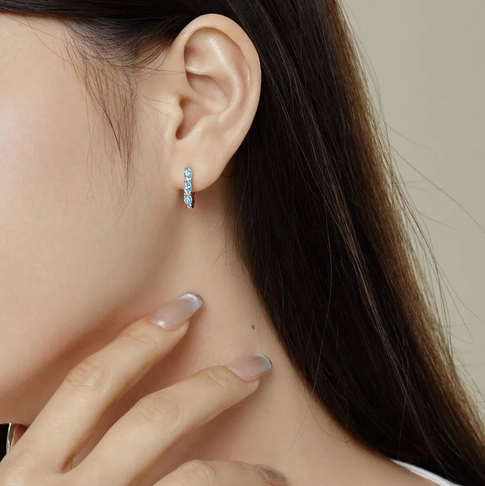 925 silver women's earrings with blue zircon inlay and platinum blue diamond electroplated finish in compact 3x14x15mm size.