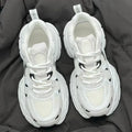 Beige mesh platform sports shoes with wedge heel and lace-up front on white background