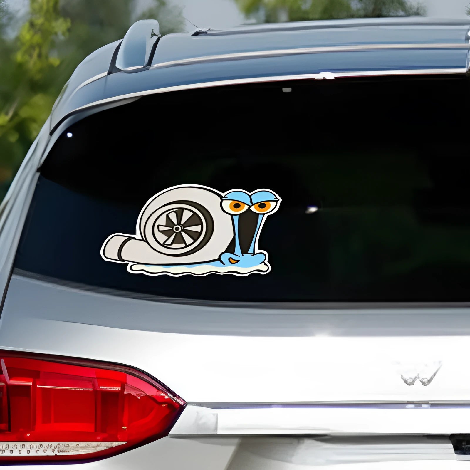 White reflective cartoon snail car sticker measuring 12 by 8 centimetres