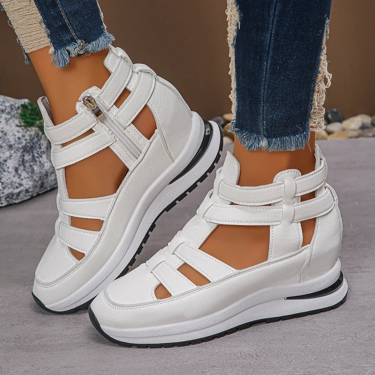 Women's black platform sandals with hollow-out design and Velcro strap.