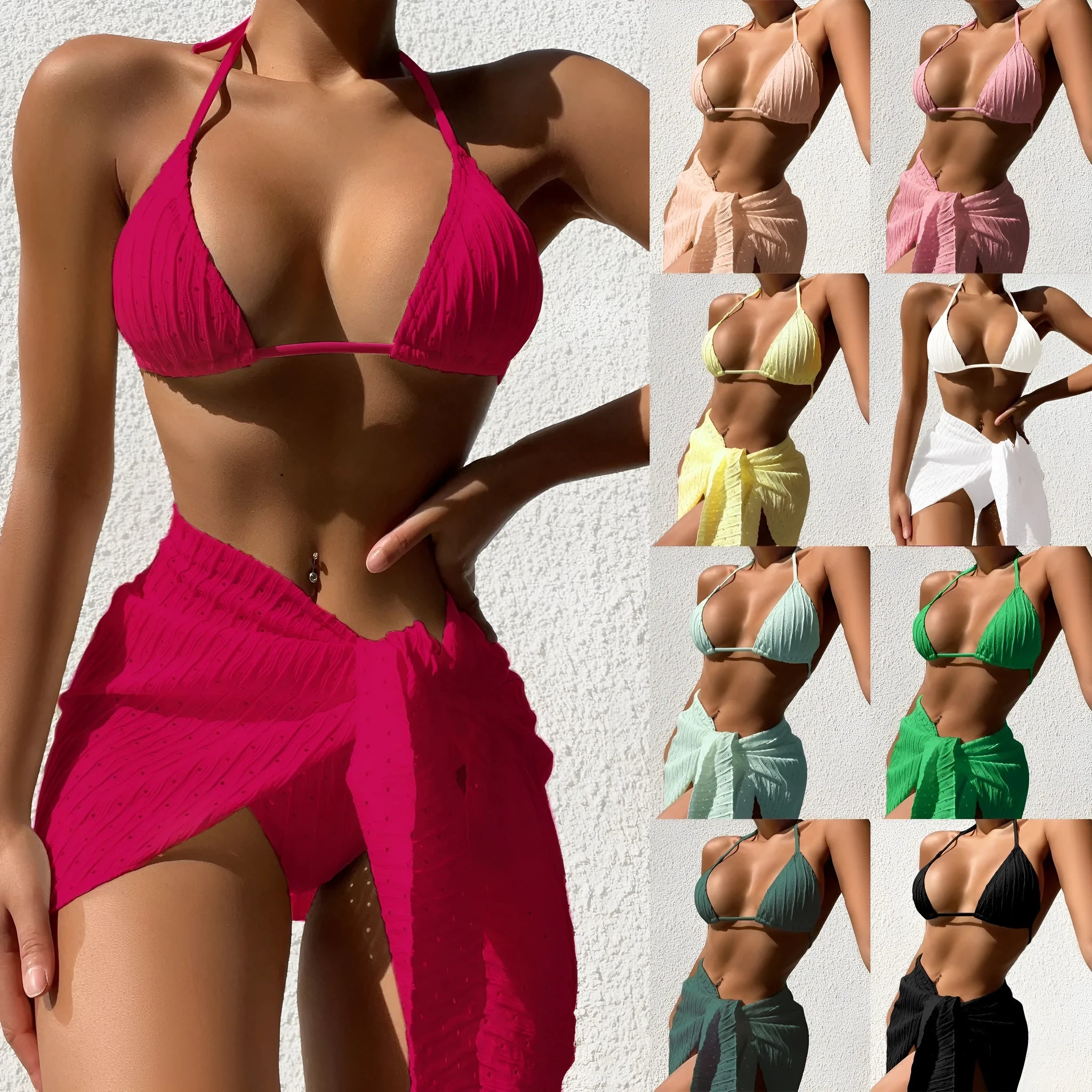 Women's black halterneck bikini set with a sheer mesh skirt, showing backless design.