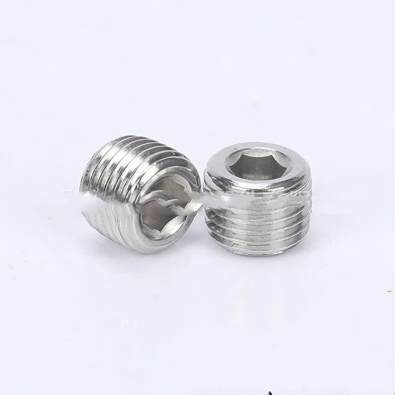 A single stainless steel pipe plug with a hexagonal head, shown against a white background.