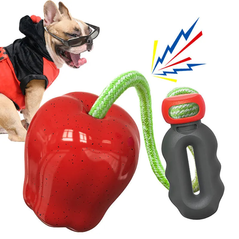 Green apple-shaped plastic dog toy with food dropping ball mechanism for dental chewing
