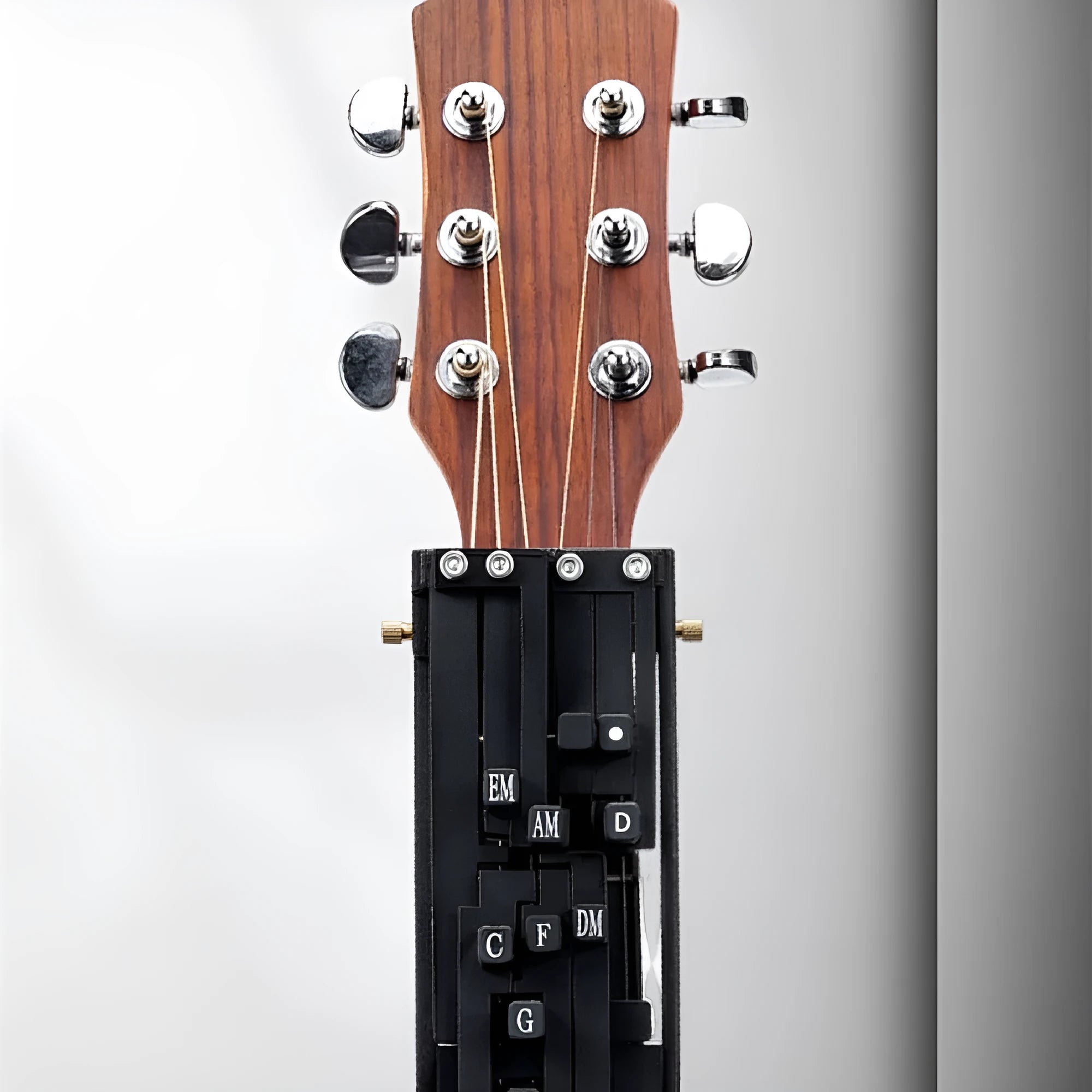 Black automatic chord device for folk guitar practice with two-chord function