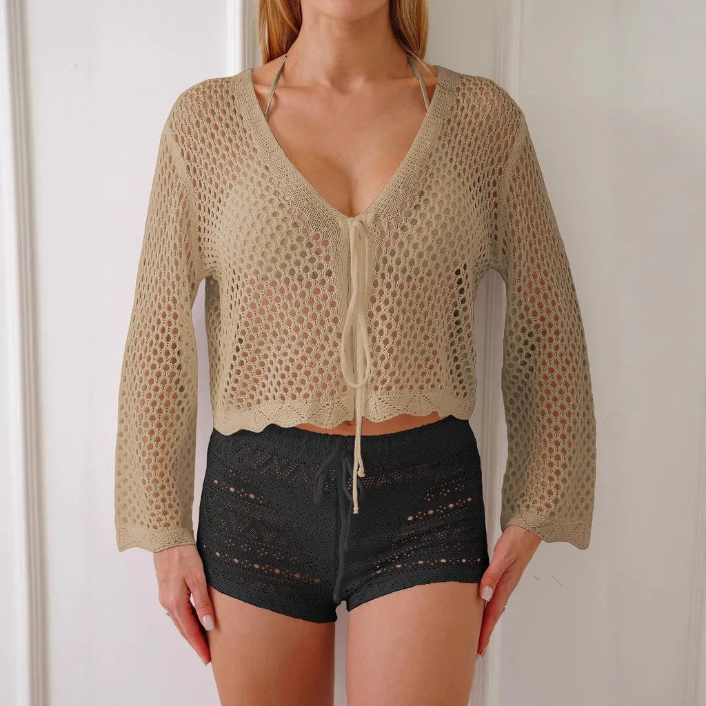 Women's hollow woven cardigan blouse with bell sleeves in apricot colour showing texture detail