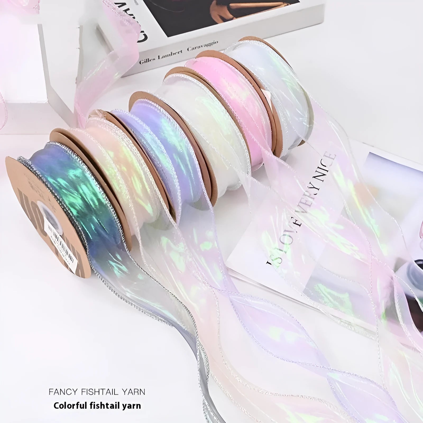 Roll of colourful fishtail yarn mesh decorative ribbon in 4cm width.