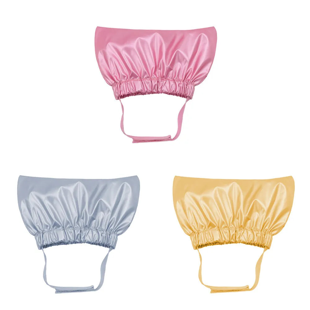 Adjustable pet shower cap in silver colour showing ear protection design and non-woven fabric construction