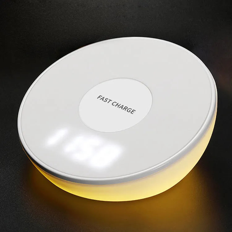 White wireless mobile phone charger with digital clock display showing the time
