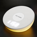 White wireless mobile phone charger with digital clock display showing the time