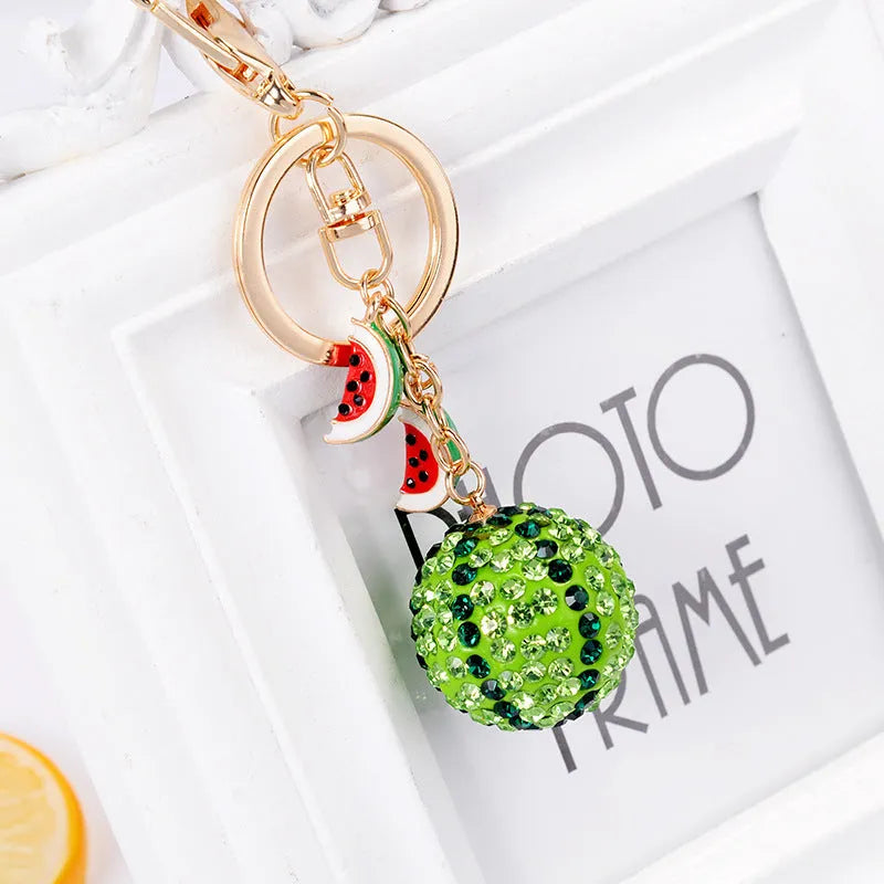 Green zinc alloy watermelon keychain shown at 12cm length.