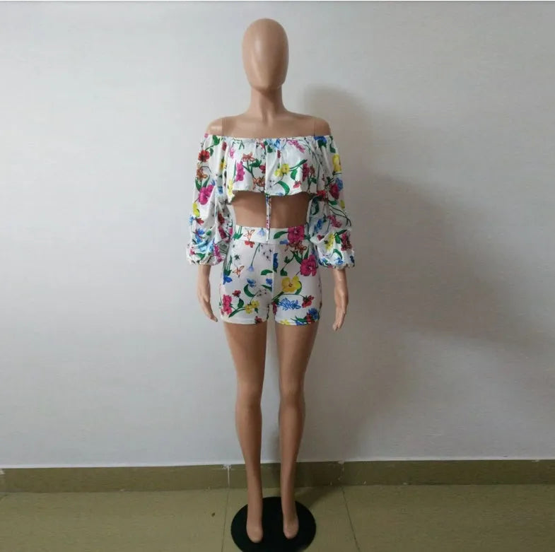 Multicolour digital print two-piece costume with fluffy sleeves and matching shorts.