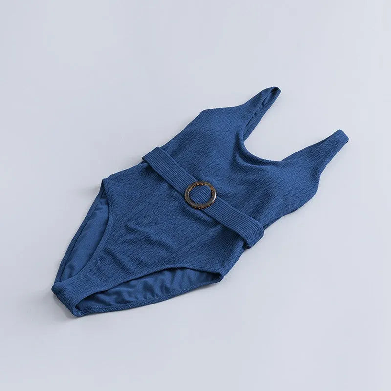 Navy blue women's one-piece triangle swimsuit with removable chest pads for swimming