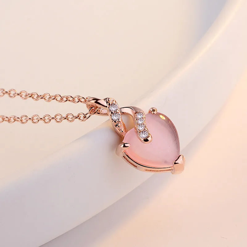 Rose gold heart necklace with pink artificial crystal pendant on cross chain