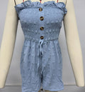 Women's sleeveless off-shoulder jumpsuit in polyester fabric showing button detailing and elastic waist