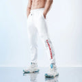 Men's black ankle-tied sweatpants with mid-waist, made from polyester and spandex blend.