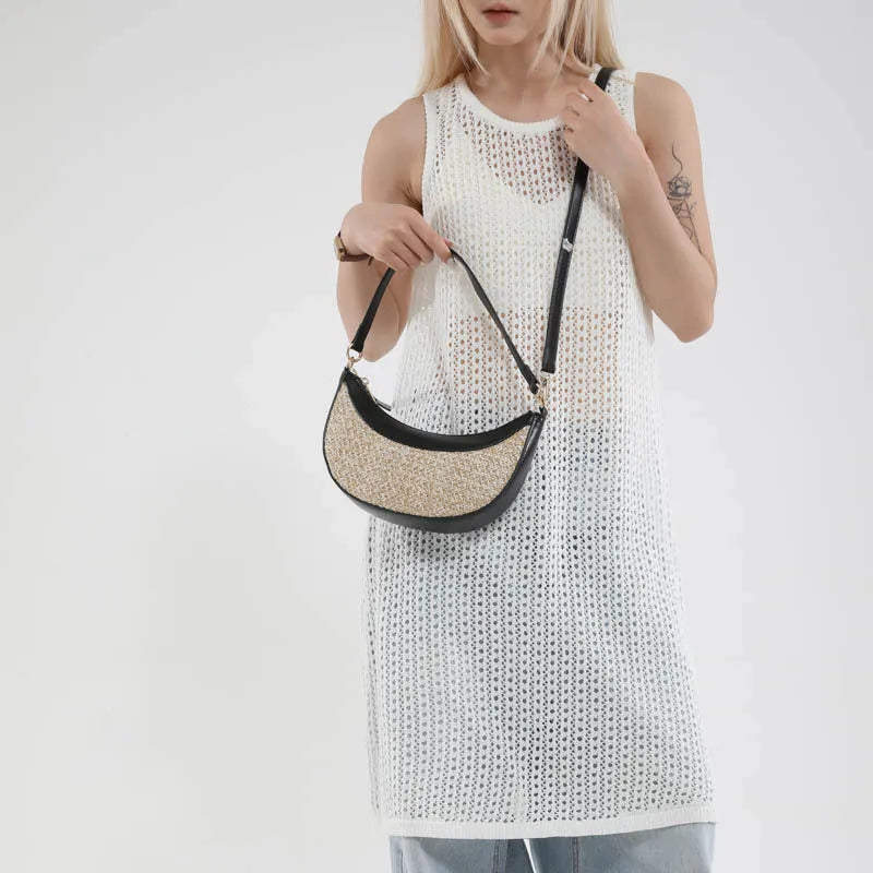 Women's straw crossbody dumpling bag with internal organisers for phone, documents, and change