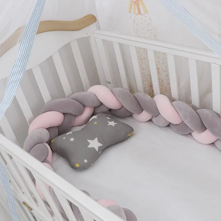 Braided knot baby crib bumper pillow in spandex velvet showing bendable design and colour options.