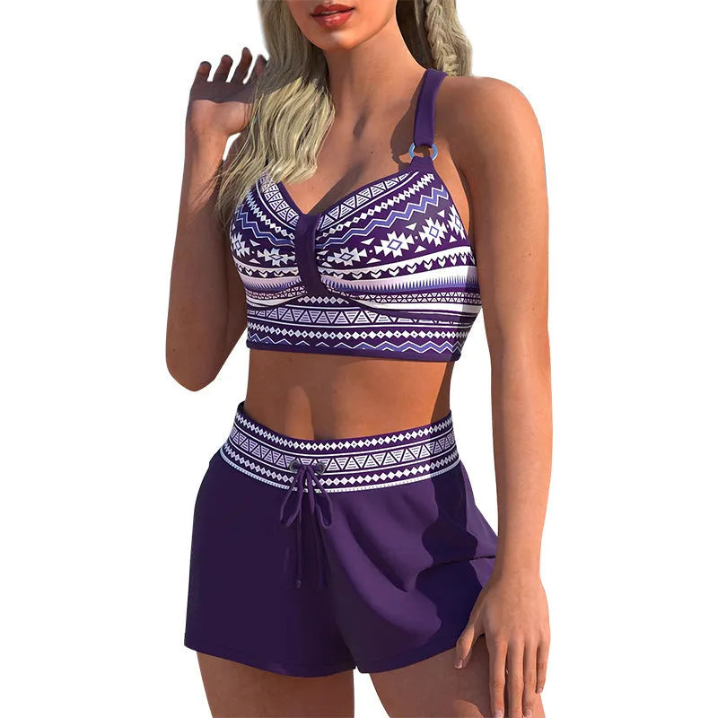 Women's two-piece polyester bikini swimsuit in a print pattern, shown on a mannequin.