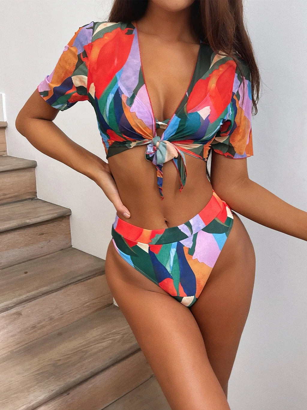 Red women's split swimsuit with printed design for swimming and water sports