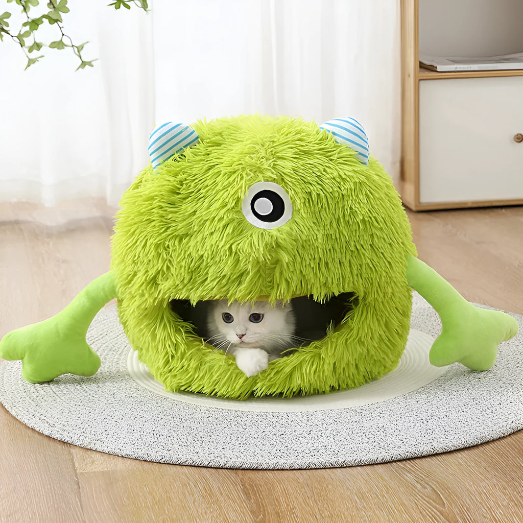 A round fluffy pet bed for cats and small dogs on a wooden floor.