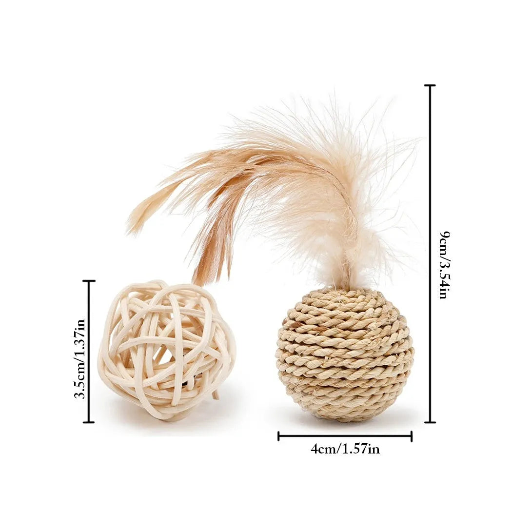 Two cat toys: a hollow rattan ball and a faux feather ball on a plain background