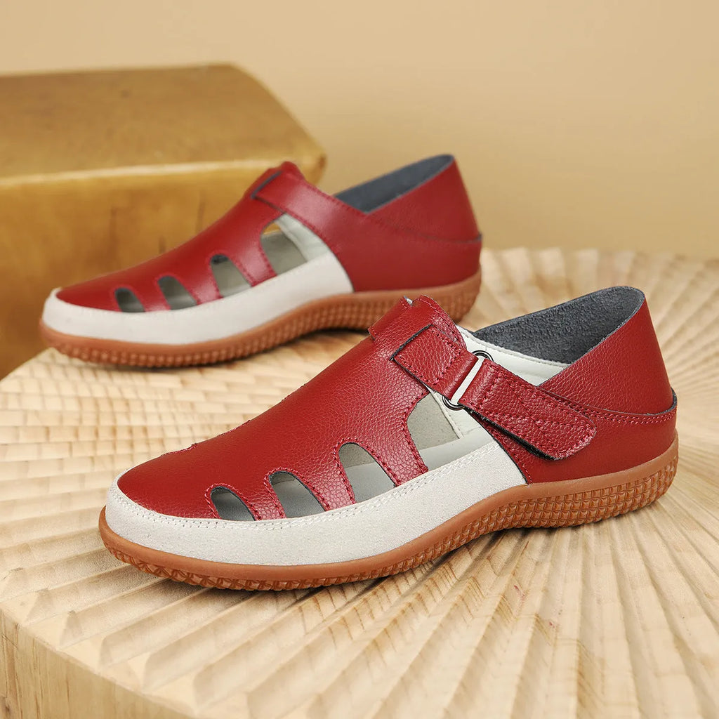 Women's plus size flat sandals with hollow out toe cap in blue, red, or white on thick rubber sole.