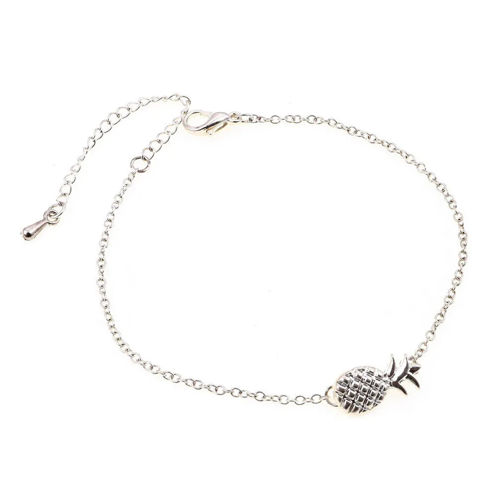 Women's gold or silver tone alloy bracelet with a pineapple charm.